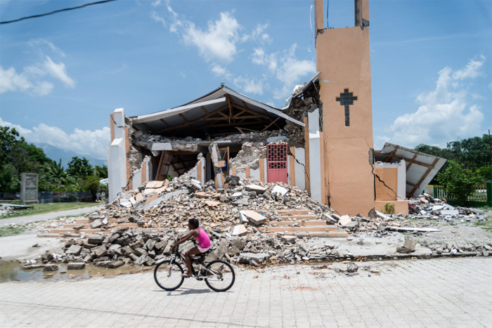 The Church St Anne is seen completely destroyed by the earthquake in Chardonnieres, Haiti on August 18, 2021. The death toll from a 7.2 magnitude earthquake that struck Haiti has risen to more than 2,100, the Caribbean nation's civil protection agency said Wednesday, as a tropical storm brought torrential downpours on survivors already coping with catastrophe. More than 12,000 people were wounded when the quake struck the southwestern part of the Caribbean nation on Saturday, about 100 miles (160 kilometers) to the west of the capital Port-au-Prince, according to the updated toll. 