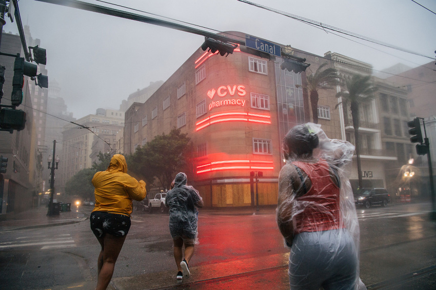 A group of people cross an intersection during Hurricane Ida on August 29, 2021, in New Orleans, Louisiana.
