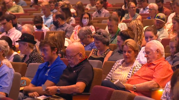 Congregants at Oak Hills Church in San Antonio, Texas, react after receiving envelopes with cash inside during a worship service on Sunday, August 29, 2021.