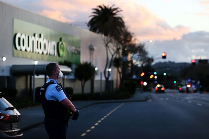 Police guard the area around Countdown LynnMall after a violent extremist stabbed six people before he was shot by police on Sept. 3, 2021 in Auckland, New Zealand. 