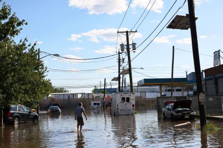 A man walks through a flooded Van Buren Street on Sept. 2, 2021 in Newark, New Jersey.
