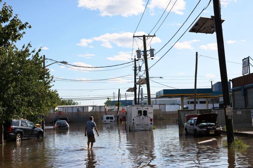 A man walks through a flooded Van Buren Street on Sept. 2, 2021 in Newark, New Jersey.