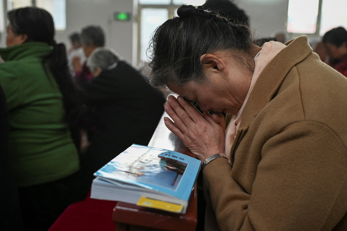 Catholic worshipers attend a morning mass on Easter Sunday at a Catholic church in a village near Beijing on April 4, 2021.