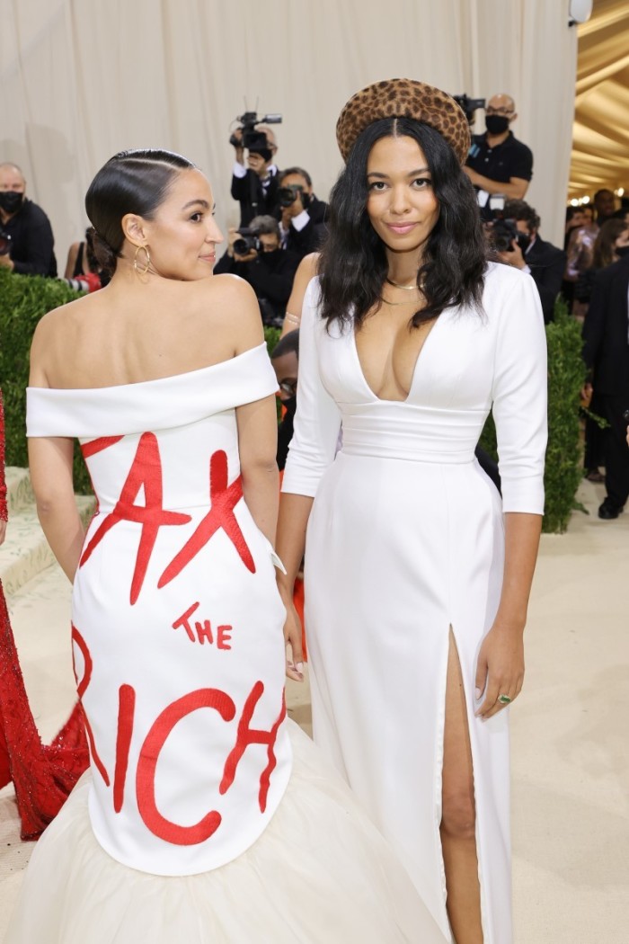 Alexandria Ocasio-Cortez and Aurora James attend The 2021 Met Gala Celebrating In America: A Lexicon Of Fashion at Metropolitan Museum of Art on September 13, 2021 in New York City. 