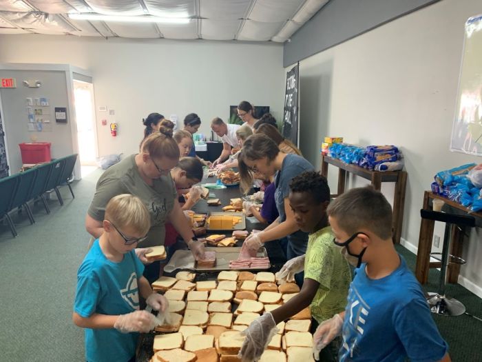 Members of the City Church in Del Rio, Texas, make sandwiches for Haitian migrants camped out under the International Bridge seeking entry into the United States. 