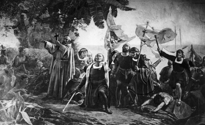 Christopher Columbus landing in America with the Piuzon Brothers bearing flags and crosses, 1492. Original Artwork: By D Puebla (1832 - 1904)
