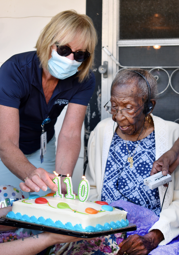 Viola Brown celebrates her 110th birthday on Oct. 4, 2021, with the help of a Blue Ridge Hospice volunteer.