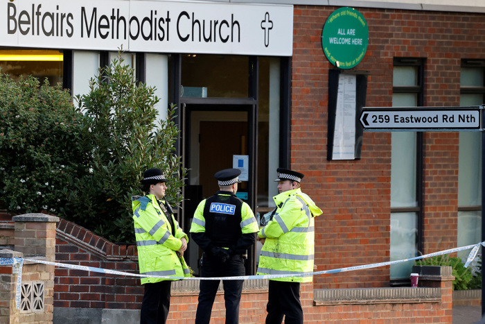 Police officers stand guard at the scene of the fatal stabbing of Conservative British lawmaker David Amess, at Belfairs Methodist Church in Leigh-on-Sea, a district of Southend-on-Sea, in southeast England on October 16, 2021. - The fatal stabbing of British lawmaker David Amess was a terrorist incident, police said Saturday, as MPs pressed for tougher security in the wake of the second killing of a U.K. politician while meeting constituents in just over five years. 