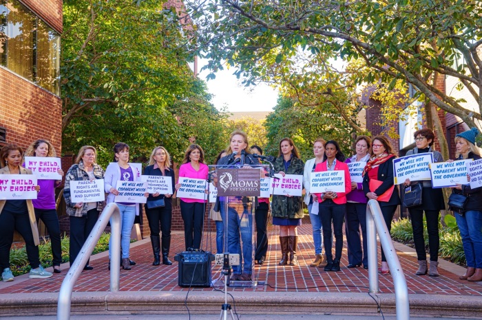 Kimberly Fletcher, president of Moms for America, speaks at a protest outside the National School Boards Association headquarters in Arlington, Virginia, Oct. 27, 2021.