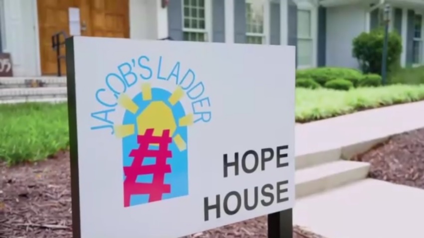 A sign sits outside of the of the Jacob's Ladder School in Roswell, Georgia.