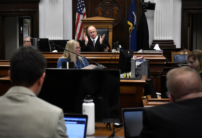 Judge Bruce Schroeder, center back, talks about the charges against Kyle Rittenhouse as Assistant District Attorneys Thomas Binger, front left, and James Kraus, front right, listen during proceedings at the Kenosha County Courthouse on November 12, 2021 in Kenosha, Wisconsin. (Photo by Sean Krajacic-Pool/Getty Images) 