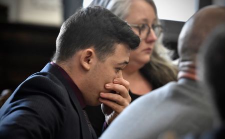 Kyle Rittenhouse puts his hand over his face as he is found not guilty on all counts at the Kenosha County Courthouse on November 19, 2021 in Kenosha, Wisconsin.