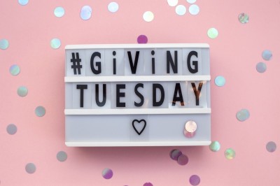 Giving Tuesday text on lightbox. Gift boxes.