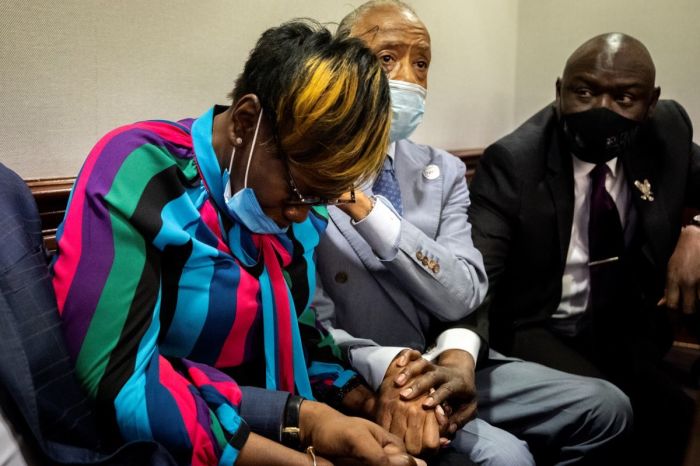 Ahmaud Arbery’s mother, Wanda Cooper-Jones (L), is comforted by Rev. Al Sharpton after the jury verdict was announced during the trial of Greg McMichael and his son, Travis McMichael and a neighbor William “Roddie” Bryan in the Glynn County Courthouse on Nov. 24, 2021, in Brunswick, Georgia. 