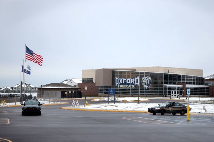 Police vehicles remain parked outside of Oxford High School on December 01, 2021 in Oxford, Michigan. Yesterday, three students were killed and eight others were injured when a gunman began shooting at the school. A 15-year-old sophomore, believed to be the only gunman, is in custody. 
