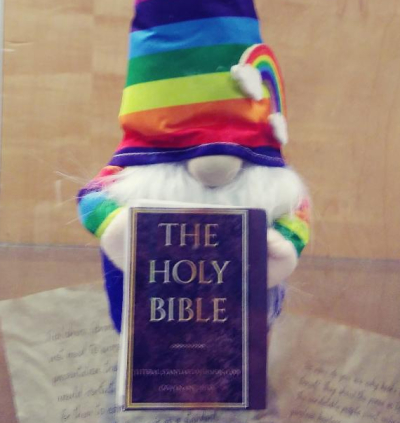 Part of the Christmas display at the Dolley Madison Library in McLean, Virginia, which has since been removed, featured a Bible alongside a troll doll in a hat emblazoned with the rainbow colors associated with the LGBT movement.
