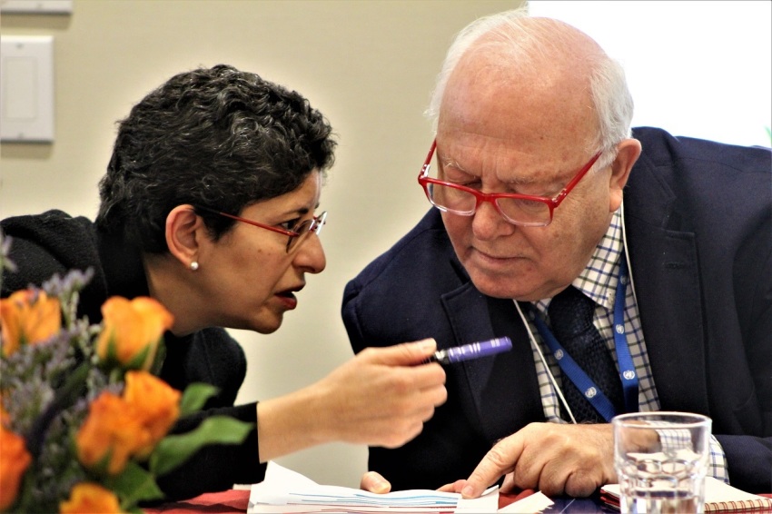 Secretary-General of Religions for Peace, Prof. Azza Karam (L), consults with United Nations Under-Secretary-General and High Representative for the United Nations Alliance of Civilizations Miguel Angel Moratinos during a discussion about the nexus between faith and diplomacy at the United Nations Church Center in New York City on Friday, Dec. 10, 2021.
