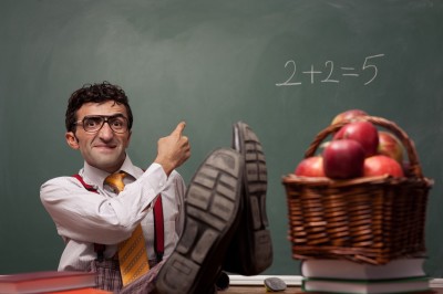 Teacher in classroom with basket of apples teaching wrong math. 