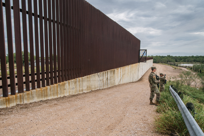 U.S. National Guard members patrol an unfinished section of border wall on November 18, 2021, in La Joya, Texas. U.S. Customs and Border Protection (CBP) recorded more than 164,000 apprehensions of illegal migrants in October. 