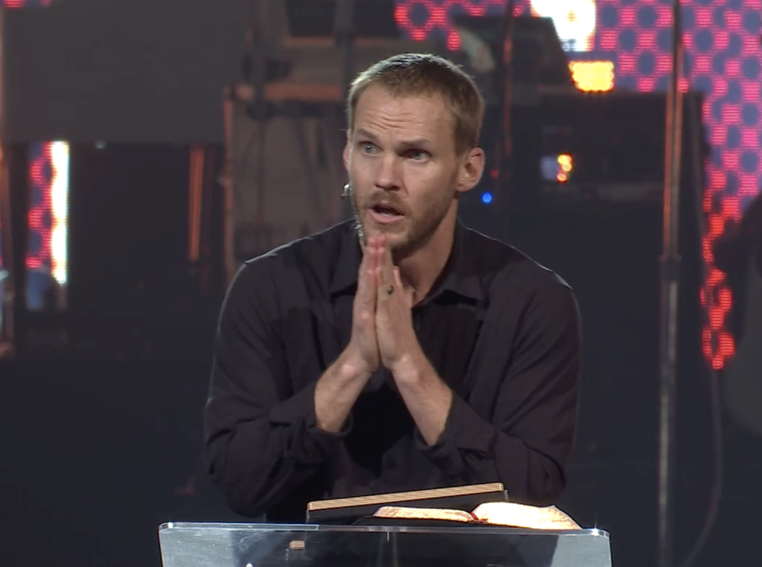 Evangelical Baptist pastor David Platt pleads with an audience of thousands of adults and teens to for them to spread the Gospel to unreached people at the annual Passion 2022 Conference in Georgia.