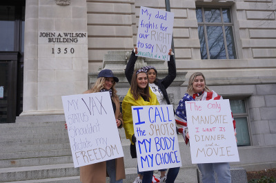 Protesters gather in front of the John A. Wilson Building, the office of Mayor Muriel Bowser of Washington, D.C., in opposition to the city's COVID-19 vaccine mandate, Jan. 15, 2022.