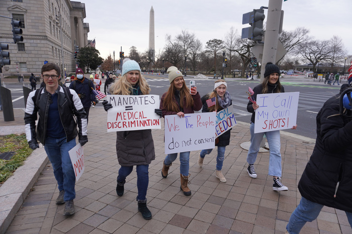 Demonstrators march from the John A. Wilson Building, the office of Mayor Muriel Bowser, to Lafayette Square near the White House in Washington, D.C., in opposition to the city's COVID-19 vaccine mandate, Jan. 15, 2022. 