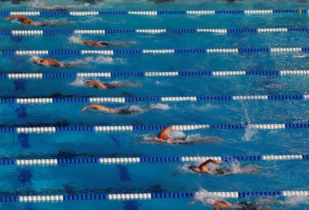 The field stays close together early in the women’s 800-meter freestyle finals during the Conoco Phillips USA Swimming National Championships at Stanford University’s Avery Aquatic Center on August 6, 2011, in Palo Alto, California.