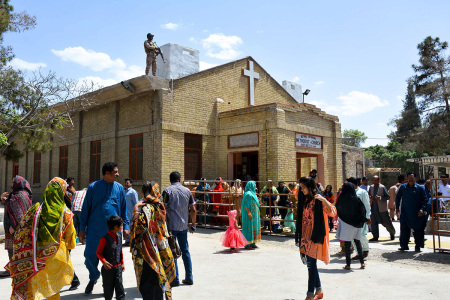 A Pakistani soldier stands guard on the roof of a Methodist Church during the Easter service in Quetta on April 21, 2019.