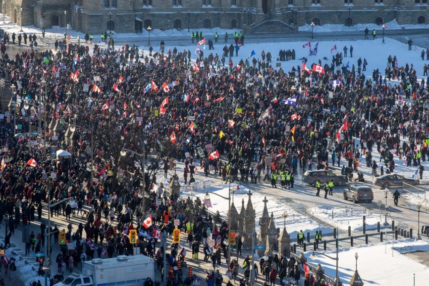 Supporters arrive at Parliament Hill for the Freedom Truck Convoy to protest against Covid-19 vaccine mandates and restrictions in Ottawa, Canada, on January 29, 2022. Hundreds of truckers drove their giant rigs into the Canadian capital Ottawa on Saturday as part of a self-titled "Freedom Convoy" to protest vaccine mandates required to cross the US border.