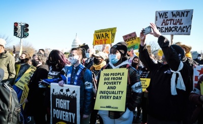 Activists tied to the Poor People’s Campaign hold a Moral March on Washington in December 2021. 