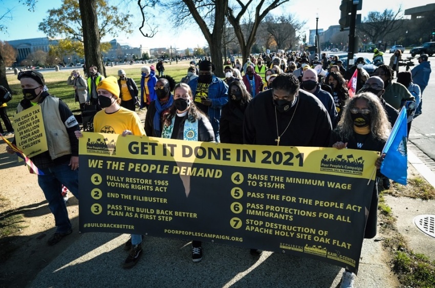 The Poor People’s Campaign holds a Moral March on Washington in December 2021. Included in this photo are the Rev. Liz Theoharis and the Rev. William Barber II.