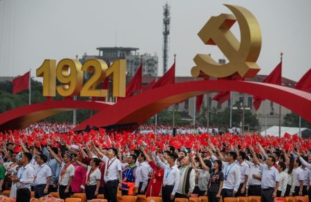 Members of the audience stand and applaud Chinese President and Chairman of the Communist Party Xi Jinping during his speech at a ceremony marking the 100th anniversary of the Communist Party at Tiananmen Square on July 1, 2021, in Beijing, China.