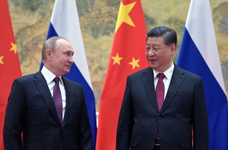 Russian President Vladimir Putin (L) and Chinese President Xi Jinping pose for a photograph during their meeting in Beijing on February 4, 2022.