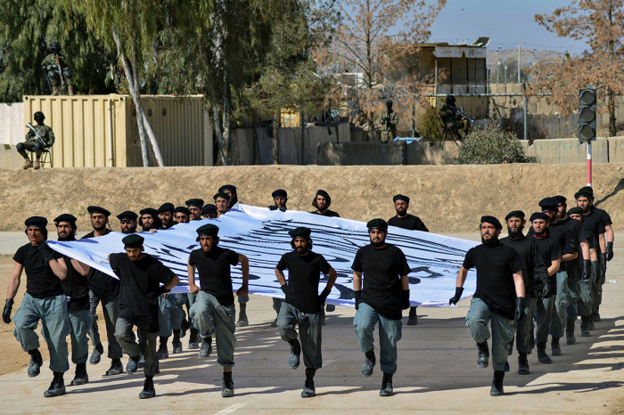 Newly recruited Taliban fighters display their skills during a graduation ceremony at the Abu Dujana National Police Training center in Kandahar on February 9, 2022.