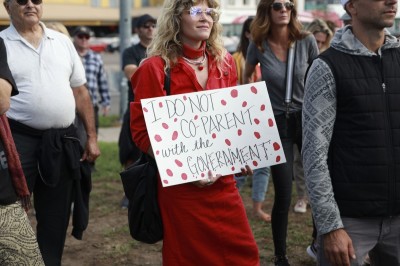 Anti-vaccine protesters stage a protest outside of the San Diego Unified School District office to protest a forced vaccination mandate for students on September 28, 2021 in San Diego, California. The School District was holding a virtual hearing on whether to enact a mandate for students to receive at least one dose of a COVID vaccine.