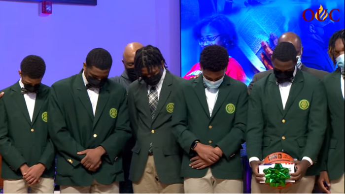Members of the Oakwood Adventist Academy pray at Oakwood University Church in Huntsville, Ala., after forfeiting a semifinal game in an Alabama State tournament on Saturday, February 19, 2022.