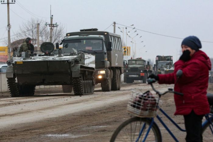 Russian army military vehicles are seen in Armyansk, Crimea, on February 25, 2022. Ukrainian forces fought off Russian invaders in the streets of the capital Kyiv on February 25, 2022. Pre-dawn blasts in Kyiv set off a second day of violence after Russian President Vladimir Putin defied Western warnings to unleash a full-scale invasion on on February 24, 2022, that quickly claimed dozens of lives and displaced at least 100,000 people. 