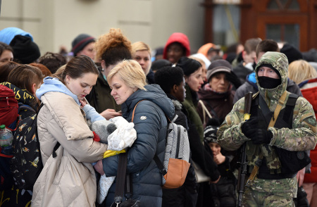People wait for a train to Poland at the railway station of the western Ukrainian city of Lviv on February 26, 2022. - Ukrainian forces repulsed a Russian attack on Kyiv but