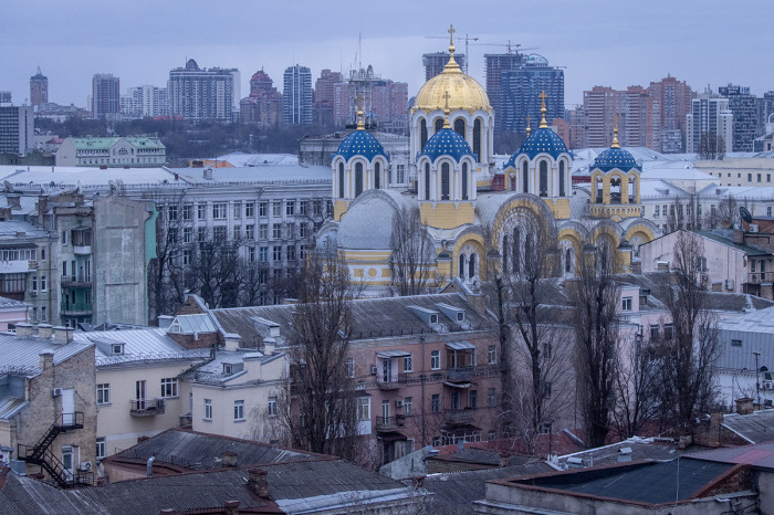 St. Volodymyr's Cathedral is seen against the city skyline during a curfew imposed from Saturday 5 p.m. to Monday 8 a.m. local time on Feb. 27, 2022, in Kyiv, Ukraine. Explosions and gunfire were reported around Kyiv as Russia's invasion of Ukraine continues. The invasion has killed scores and prompted widespread condemnation from US and European leaders. 