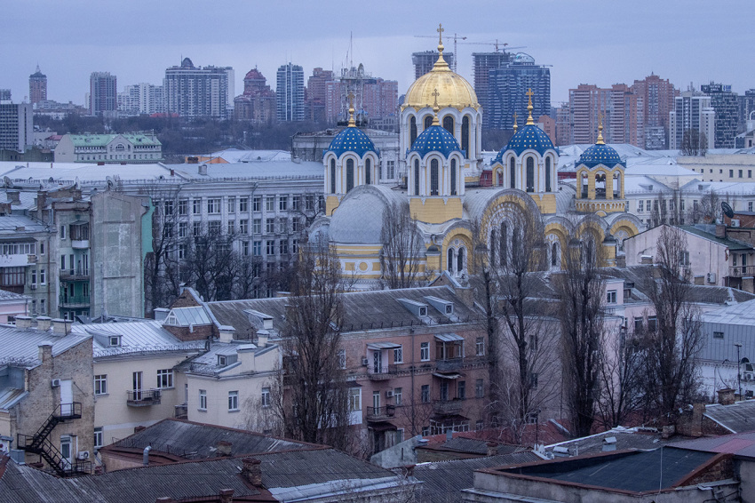 St. Volodymyr's Cathedral is seen against the city skyline during a curfew imposed from Saturday 5 p.m. to Monday 8 a.m. local time on Feb. 27, 2022, in Kyiv, Ukraine. Explosions and gunfire were reported around Kyiv as Russia's invasion of Ukraine continues. The invasion has killed scores and prompted widespread condemnation from US and European leaders.