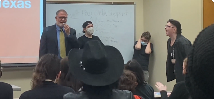Protesters scream at Jeff Younger, who has received national attention for his opposition to his ex-wife’s efforts to transition his son into a female, as he attempts to give a speech at the University of North Texas in Denton, Texas, March 2, 2022.