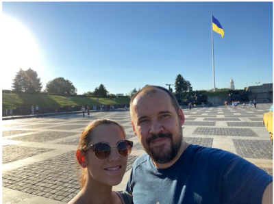 Ukrainian Christian Ruslan Maliuta and his wife pose for a picture in front of the World War II Memorial in Kyiv, Ukraine. Maliuta left to Western Europe with his wife and five children before Russia invaded Ukraine. 