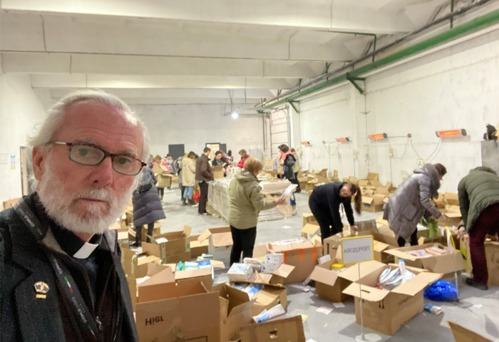 Pastor Bill Devlin, the outreach pastor at Infinity Bible Church in Bronx, New York, stands in a warehouse in the western Ukraine, where 'all kinds of goods are coming in from around the world' to help the Ukrainian people as the conflict between the Eastern European country and Russia continues, March 15, 2022. 