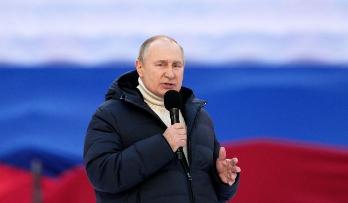 Russian President Vladimir Putin gives a speech at a concert marking the eighth anniversary of Russia's annexation of Crimea at the Luzhniki stadium in Moscow on March 18, 2022. 