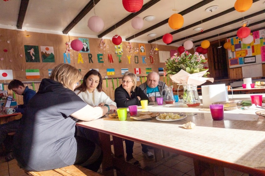 Natasha (middle-left) registers a Ukrainian refugee at a shelter in just outside Bialystok, Poland.