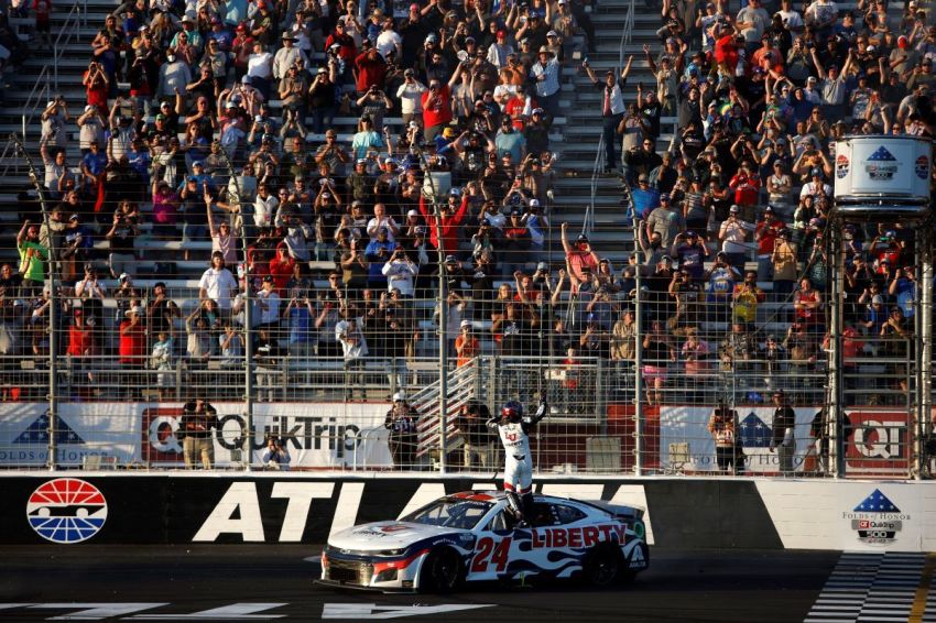 William Byron, driver of the #24 Liberty University Chevrolet, celebrates after winning the NASCAR Cup Series Folds of Honor QuikTrip 500 at Atlanta Motor Speedway on March 20, 2022, in Hampton, Georgia. 