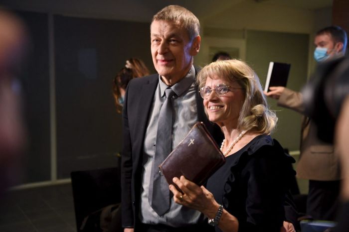 Päivi Räsänen holds a bible as she arrives with her husband, Niilo Rasanen, to attend a court session at the Helsinki District Court in Helsinki, Finland on January 24, 2022. 