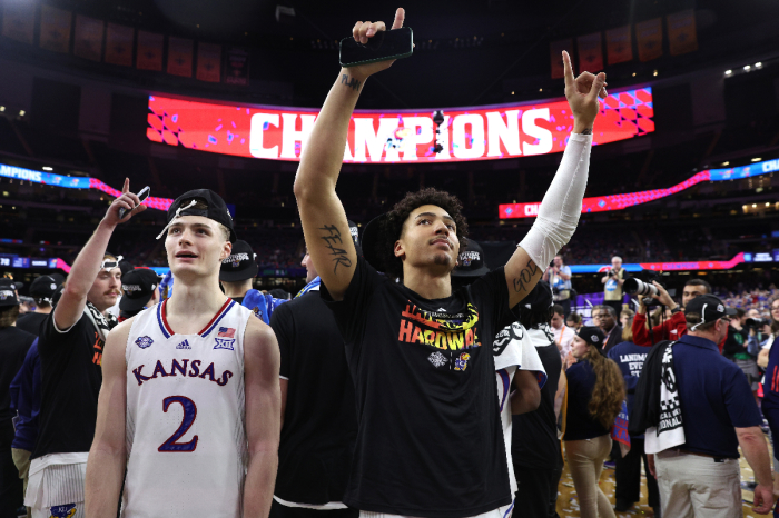 Christian Braun #2 and Jalen Wilson #10 of the Kansas Jayhawks celebrate after defeating the North Carolina Tar Heels during the 2022 NCAA Men's Basketball Tournament National Championship at Caesars Superdome on April 04, 2022 in New Orleans, Louisiana. 