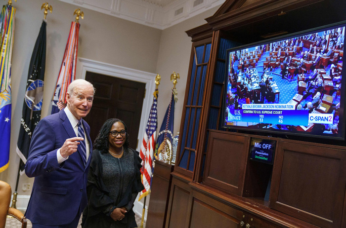 President Joe Biden and Judge Ketanji Brown Jackson watch the Senate vote on her nomination to be an associate justice on the U.S. Supreme Court, from the Roosevelt Room of the White House in Washington, D.C., on April 7, 2022. 