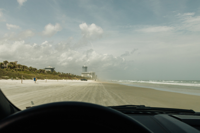 Driving on the 23 miles of white-sand beach in Daytona Beach, Florida. 
